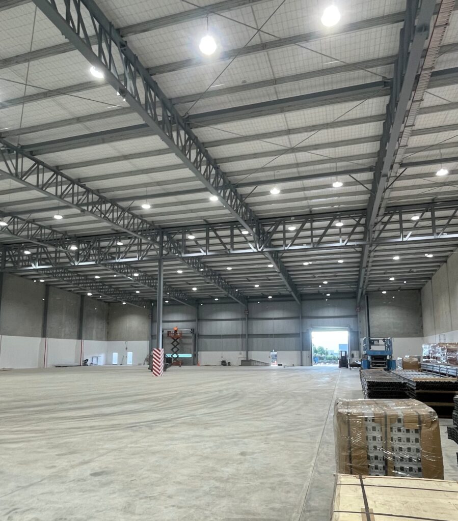 Image of empty warehouse with lighting and working electrics by Instant Electrical providing electrical maintenance in Christchurch, including Belfast, Cashmere, Hornby, Riccarton, Northwood, Shirley, Papanui and Wainoni